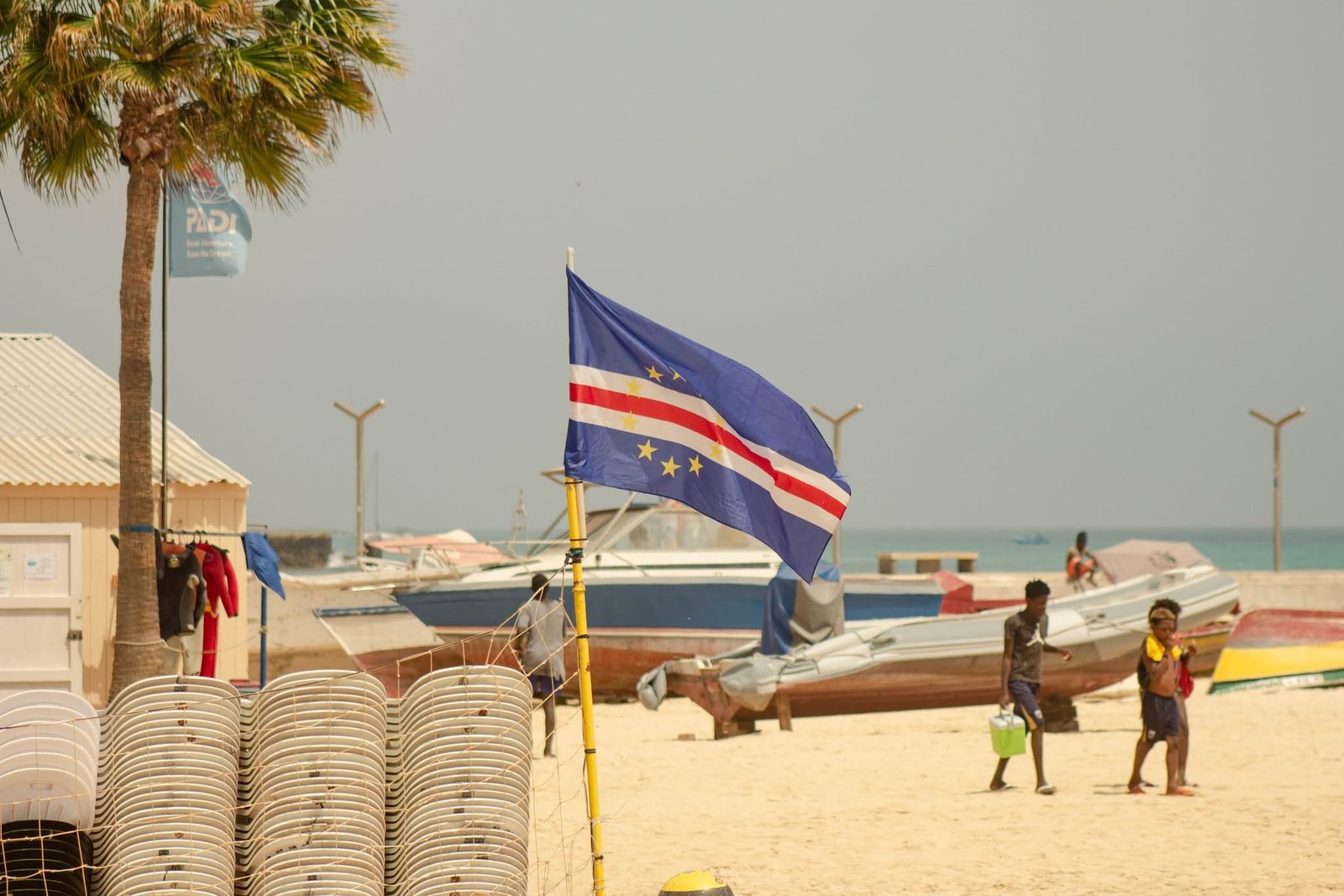 Cape Verdean flag on the wind, on the beach of Santa Maria, Sal Cape Verdean flag on the wind, on the beach of Santa Maria, Sal